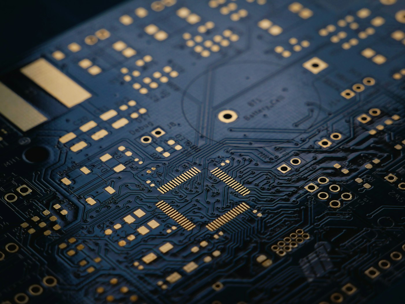 A dark blue circuit board up close