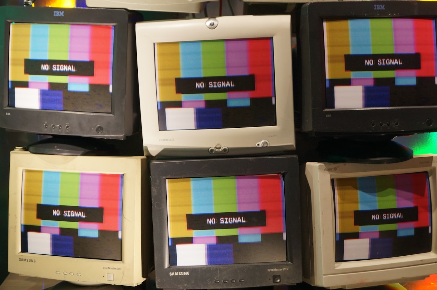 A stack of assorted CRT monitors